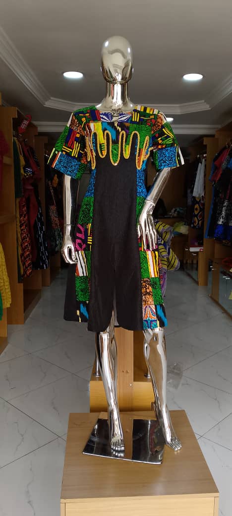 Crepes gown with Ankara patches and spiral EMB
